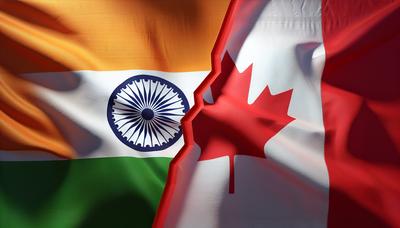 Vlaggen van India en Canada met spanningssymbool.